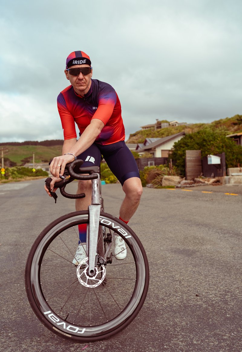 Sam balancing on his bike in the iRIDE kit.